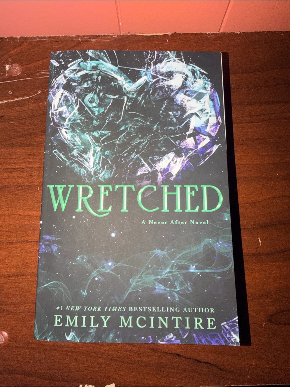 Wretched by — Black & Teal Paperback Novel
